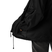 Nileos Basic-Unisex-Windbreaker in Schwarz – Detailaufnahme Bündchen – Miniaturansicht 14